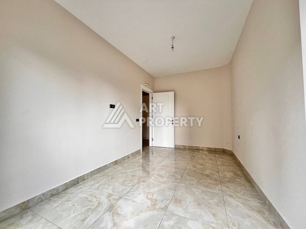 Квартира 2+1 в новом комплексе у моря в районе Махмутлар, улица Барбароса - Ракурс 7