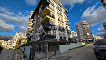 Квартира 1+1 в Махмутларе, 55 кв.м. - Ракурс 1