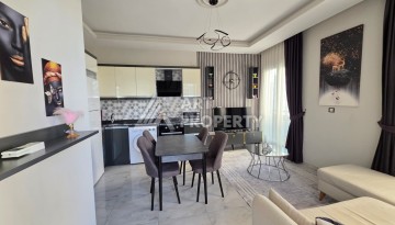 Квартира 1+1 в Махмутларе, 55 кв.м. - Ракурс 8