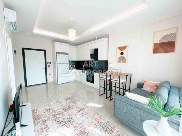 Светлая квартира 1+1 в районе Махмутлар, 50 кв.м. - Ракурс 13