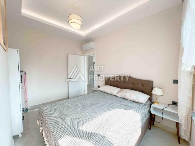 Светлая квартира 1+1 в районе Махмутлар, 50 кв.м. - Ракурс 19