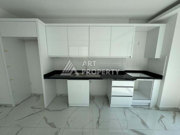 Недорогая квартира 1+1 в новом доме — отличный старт для недвижимости в Турции - Ракурс 1