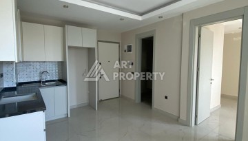 Новая квартира 1+1 на улице Барбароса в Махмутларе, вторая линия от моря - Ракурс 4