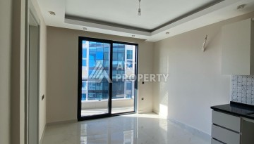 Новая квартира 1+1 на улице Барбароса в Махмутларе, вторая линия от моря - Ракурс 18