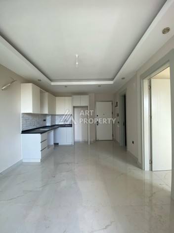 Новая квартира 1+1 на улице Барбароса в Махмутларе, вторая линия от моря - Ракурс 20