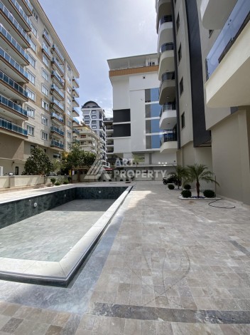 Новая квартира 1+1 на улице Барбароса в Махмутларе, вторая линия от моря - Ракурс 24