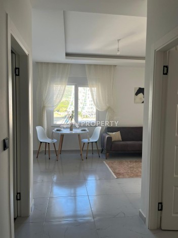 Недорогая квартира 1+1 в Махмутларе, 52 м², 600 м до моря - Ракурс 2