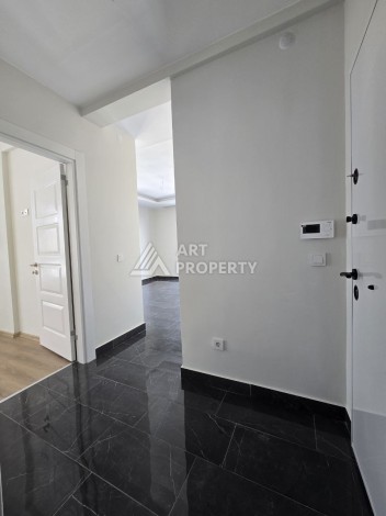 Квартира 1+1 с панорамным видом на горы в Махмутларе, 54 м², 600 м до моря - Ракурс 2