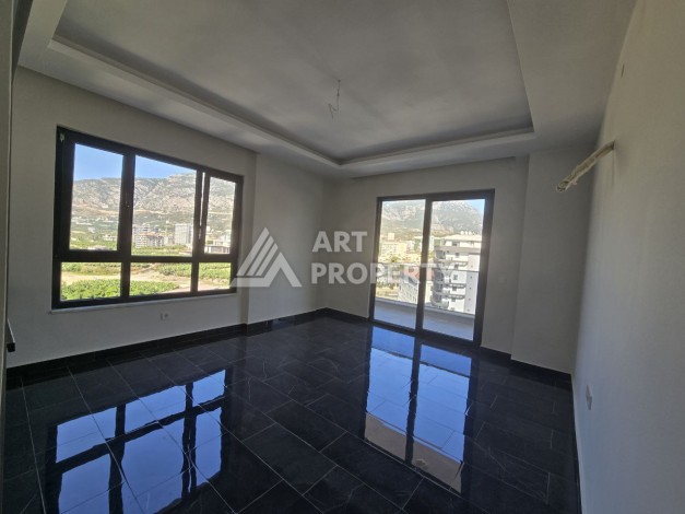 Квартира 1+1 с панорамным видом на горы в Махмутларе, 54 м², 600 м до моря - Ракурс 6