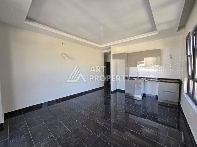 Квартира 1+1 с панорамным видом на горы в Махмутларе, 54 м², 600 м до моря - Ракурс 7