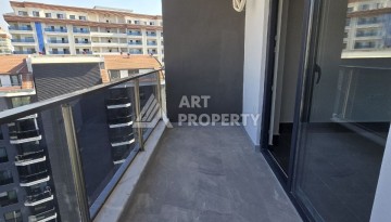 Квартира 1+1 с панорамным видом на горы в Махмутларе, 54 м², 600 м до моря - Ракурс 11