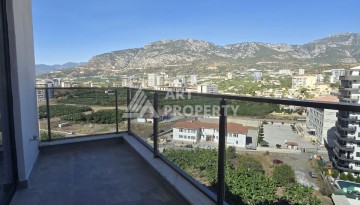 Квартира 1+1 с панорамным видом на горы в Махмутларе, 54 м², 600 м до моря - Ракурс 12