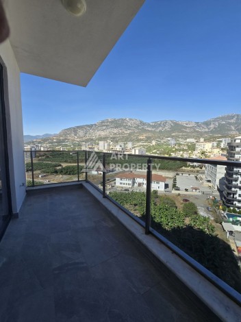 Квартира 1+1 с панорамным видом на горы в Махмутларе, 54 м², 600 м до моря - Ракурс 11