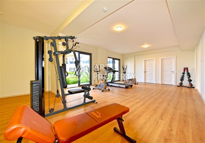 Квартира 1+1 с панорамным видом на горы в Махмутларе, 54 м², 600 м до моря - Ракурс 12