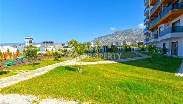 Квартира 1+1 с панорамным видом на горы в Махмутларе, 54 м², 600 м до моря - Ракурс 16