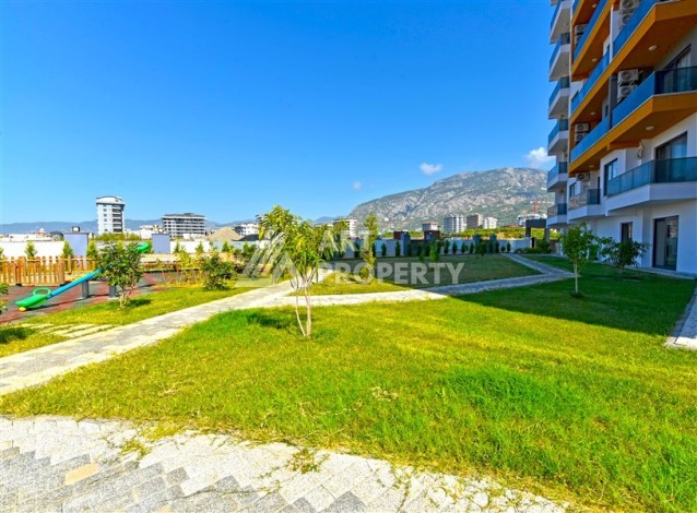 Квартира 1+1 с панорамным видом на горы в Махмутларе, 54 м², 600 м до моря - Ракурс 15