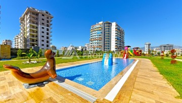 Квартира 1+1 с панорамным видом на горы в Махмутларе, 54 м², 600 м до моря - Ракурс 17