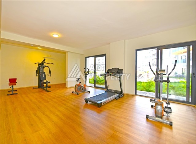 Квартира 1+1 с панорамным видом на горы в Махмутларе, 54 м², 600 м до моря - Ракурс 17