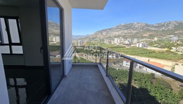 Квартира 1+1 с панорамным видом на горы в Махмутларе, 54 м², 600 м до моря - Ракурс 19