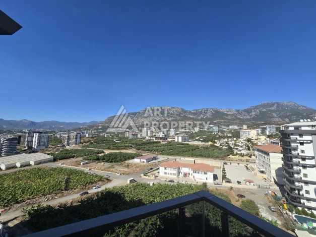 Квартира 1+1 с панорамным видом на горы в Махмутларе, 54 м², 600 м до моря - Ракурс 19