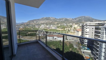 Квартира 1+1 с панорамным видом на горы в Махмутларе, 54 м², 600 м до моря - Ракурс 22