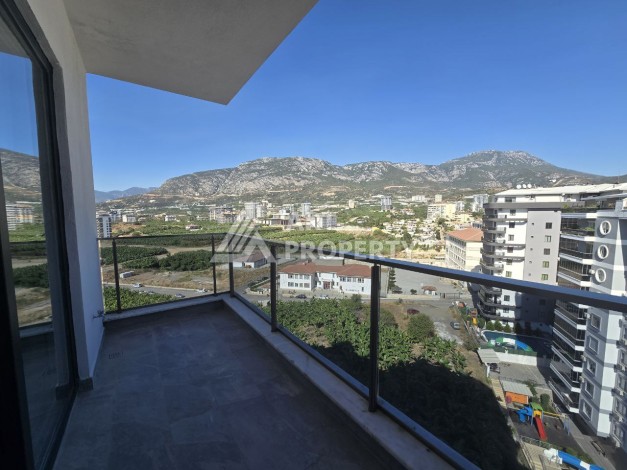 Квартира 1+1 с панорамным видом на горы в Махмутларе, 54 м², 600 м до моря - Ракурс 21