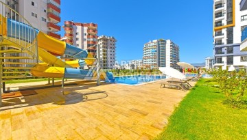 Квартира 1+1 с панорамным видом на горы в Махмутларе, 54 м², 600 м до моря - Ракурс 25