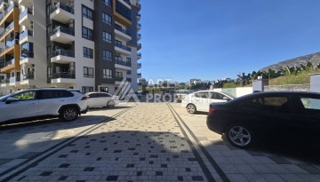 Квартира 1+1 с панорамным видом на горы в Махмутларе, 54 м², 600 м до моря - Ракурс 27
