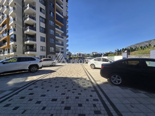 Квартира 1+1 с панорамным видом на горы в Махмутларе, 54 м², 600 м до моря - Ракурс 27