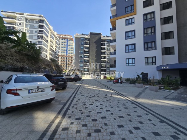 Квартира 1+1 с панорамным видом на горы в Махмутларе, 54 м², 600 м до моря - Ракурс 28