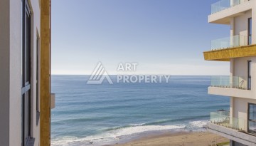 Квартира 1+1 на первой береговой линии в Махмутларе, 55 м², высокий арендный потенциал - Ракурс 1