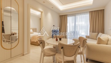 Квартира 1+1 на первой береговой линии в Махмутларе, 55 м², высокий арендный потенциал - Ракурс 2