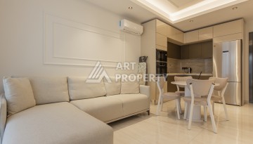 Квартира 1+1 на первой береговой линии в Махмутларе, 55 м², высокий арендный потенциал - Ракурс 4