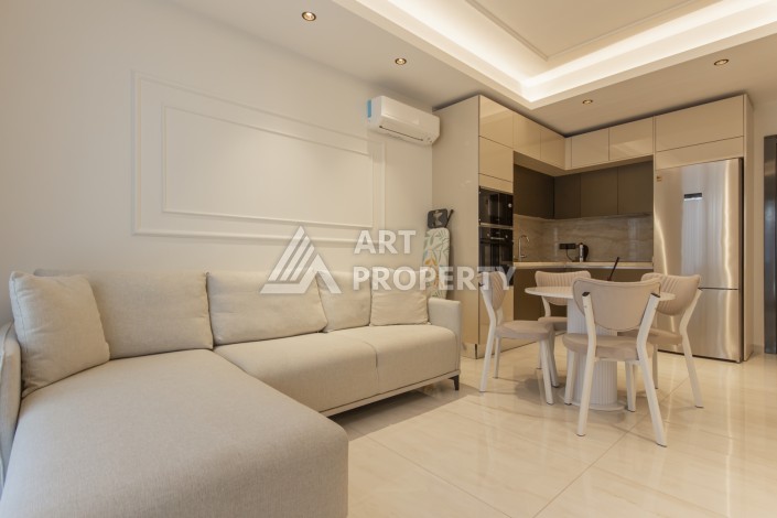 Квартира 1+1 на первой береговой линии в Махмутларе, 55 м², высокий арендный потенциал - Ракурс 3