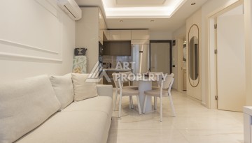 Квартира 1+1 на первой береговой линии в Махмутларе, 55 м², высокий арендный потенциал - Ракурс 5