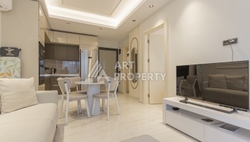 Квартира 1+1 на первой береговой линии в Махмутларе, 55 м², высокий арендный потенциал - Ракурс 6