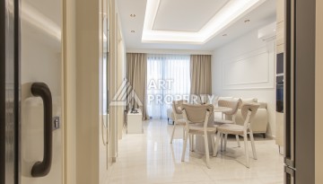 Квартира 1+1 на первой береговой линии в Махмутларе, 55 м², высокий арендный потенциал - Ракурс 7