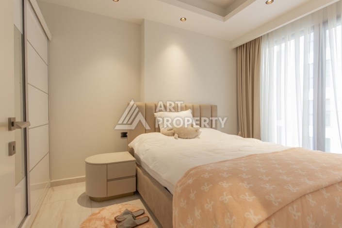 Квартира 1+1 на первой береговой линии в Махмутларе, 55 м², высокий арендный потенциал - Ракурс 7