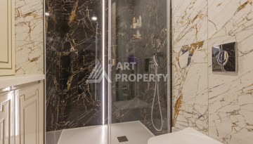 Квартира 1+1 на первой береговой линии в Махмутларе, 55 м², высокий арендный потенциал - Ракурс 10