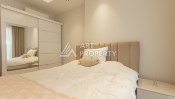 Квартира 1+1 на первой береговой линии в Махмутларе, 55 м², высокий арендный потенциал - Ракурс 11