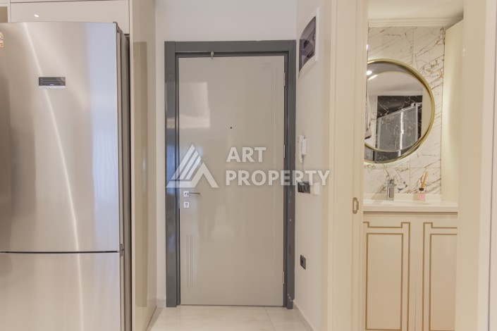 Квартира 1+1 на первой береговой линии в Махмутларе, 55 м², высокий арендный потенциал - Ракурс 12