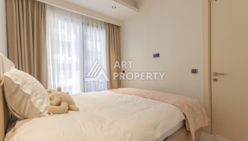 Квартира 1+1 на первой береговой линии в Махмутларе, 55 м², высокий арендный потенциал - Ракурс 15