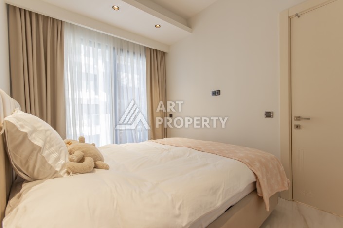 Квартира 1+1 на первой береговой линии в Махмутларе, 55 м², высокий арендный потенциал - Ракурс 14