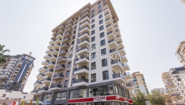 Квартира 1+1 в новом доме 2025 года в Махмутларе, 600 м до моря - Ракурс 1