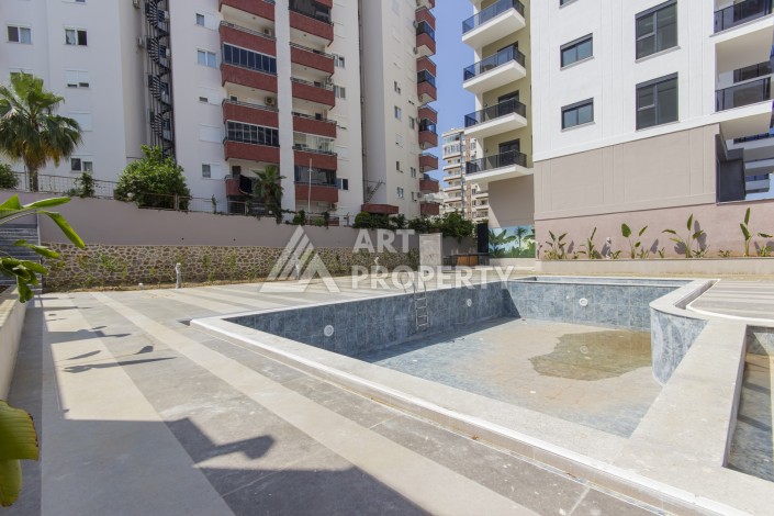 Квартира 1+1 в новом доме 2025 года в Махмутларе, 600 м до моря - Ракурс 17