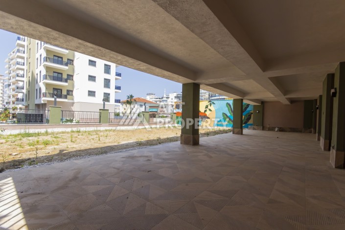 Квартира 1+1 в новом доме 2025 года в Махмутларе, 600 м до моря - Ракурс 20