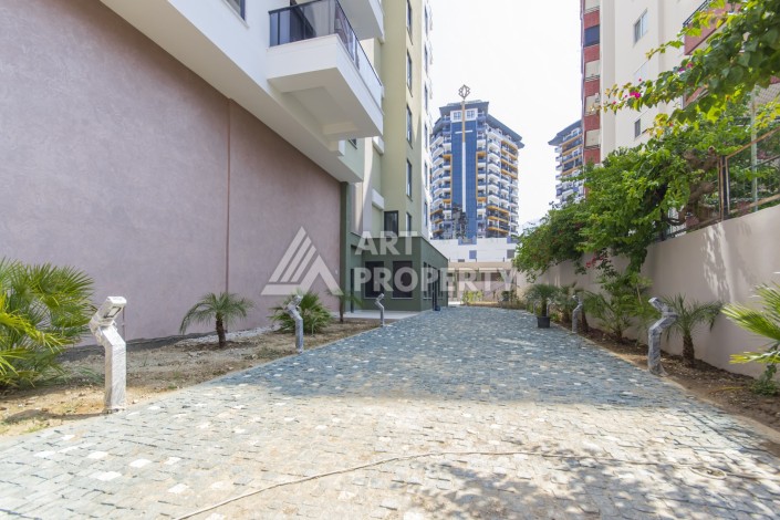 Квартира 1+1 в новом доме 2025 года в Махмутларе, 600 м до моря - Ракурс 21