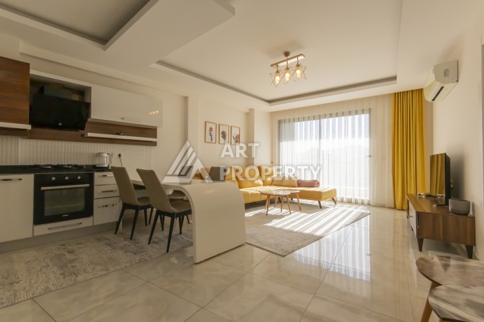 Просторная квартира 1+1 с видом на море и горы в Махмутларе, 75 м² - Ракурс 3