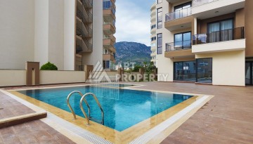 Недорогая квартира 1+1 в Махмутларе, 55 кв.м. - Ракурс 24