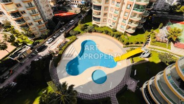 Квартира 2+1 в популярной резиденции на ул.Ататюрка в Махмутларе, 120 кв.м. - Ракурс 1